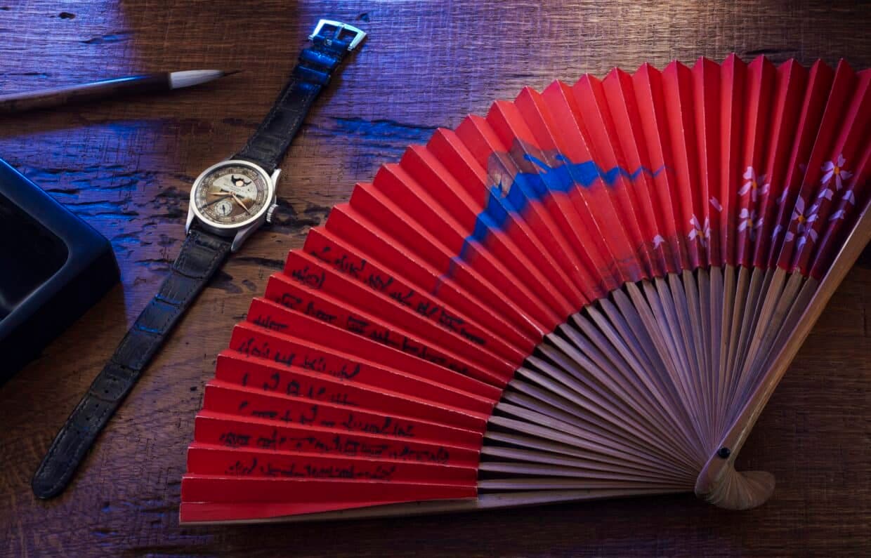 A Patek Philippe Reference 96 Quantieme Lune formerly from the collection of Aisin Giro Puyi and a Paper Fan