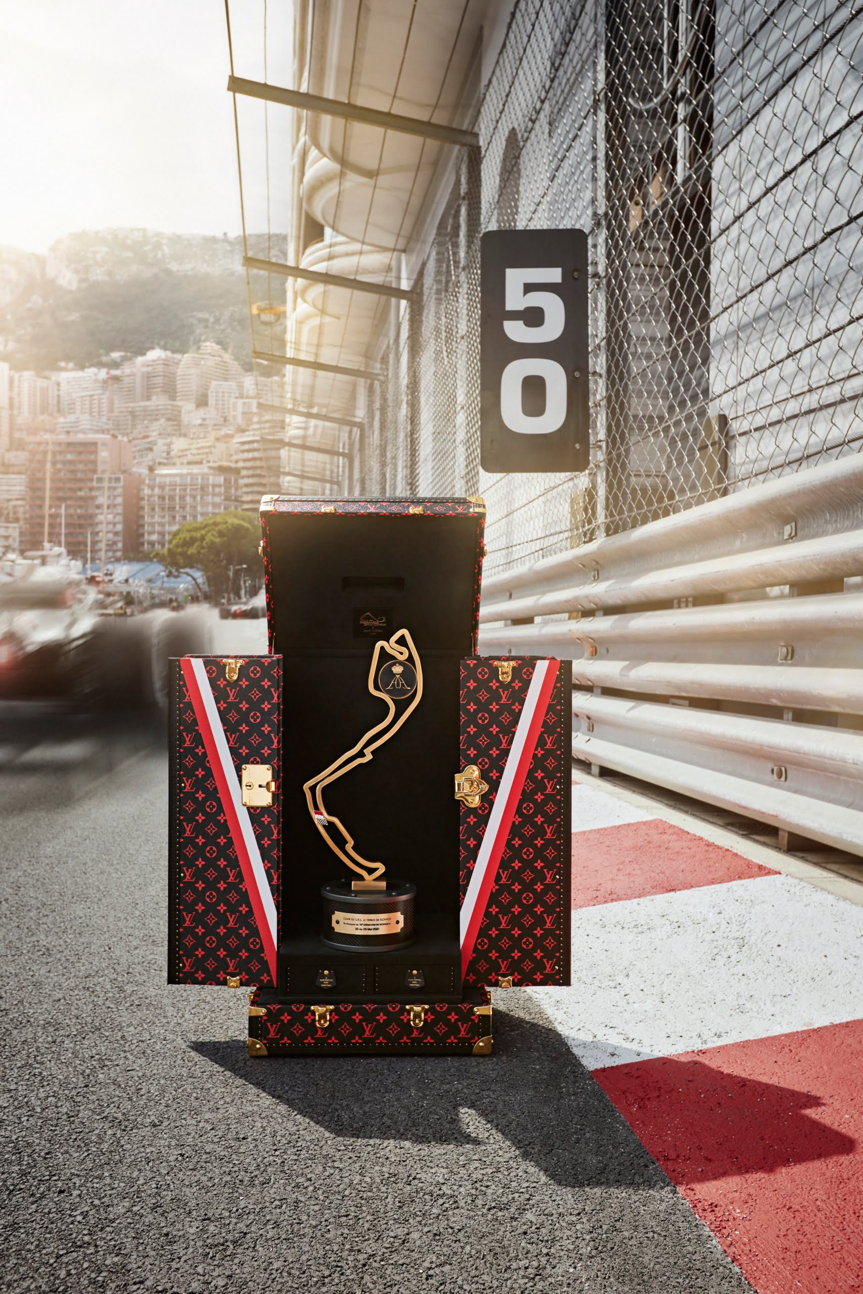 A Trophy Travel Case by Louis Vuitton at the Grand Prix